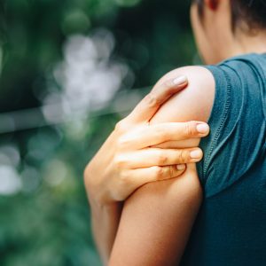 Woman with pain in shoulder and upper arm ,Ache in human body , office syndrome , health care concept